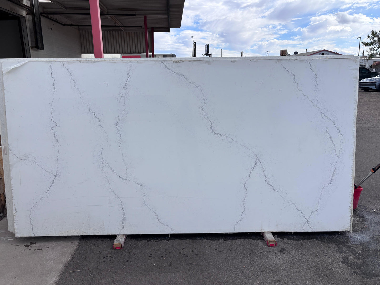 Large white marble LOOKING slab with gray veins outdoors