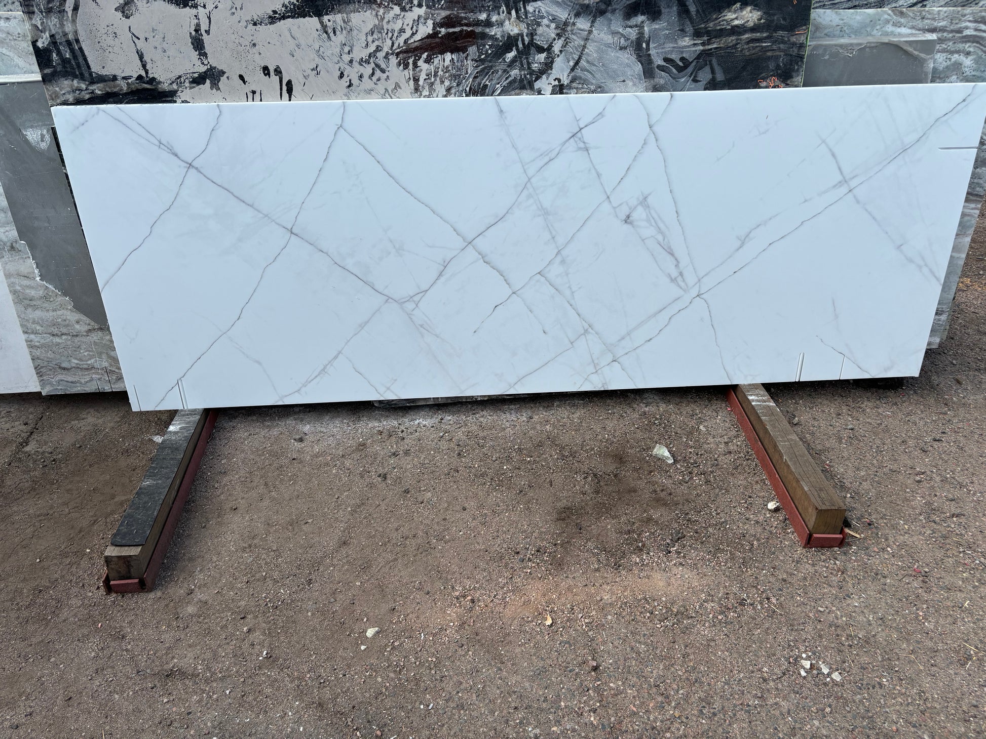 Modern white quartz that look like marble with gray veins.