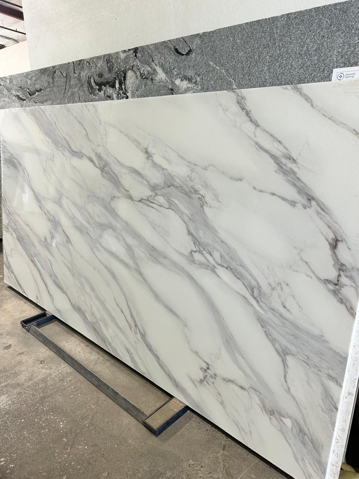 Modern off white quartz with gray veins. Marble look European Kitchen design.