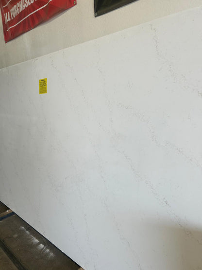 White quartz with light gray veins. Jumbo slab for sale in Phoenix Stone Warehouse. Quartz countertops.