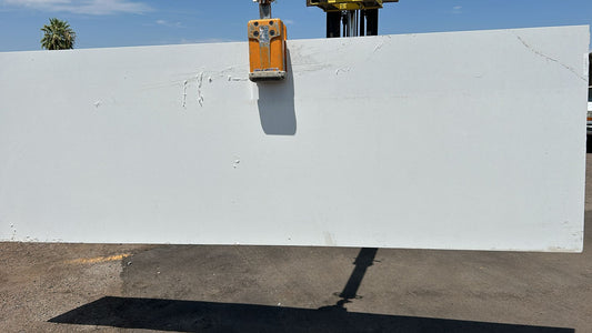 White 2cm quartz countertops remnant with freckles all over. Classic stone. Timeless piece.