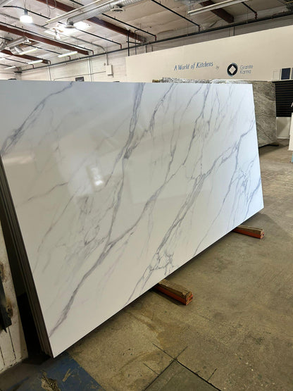 Inkprinted modern white luxury quartz countertop full slab with marble looking veins.