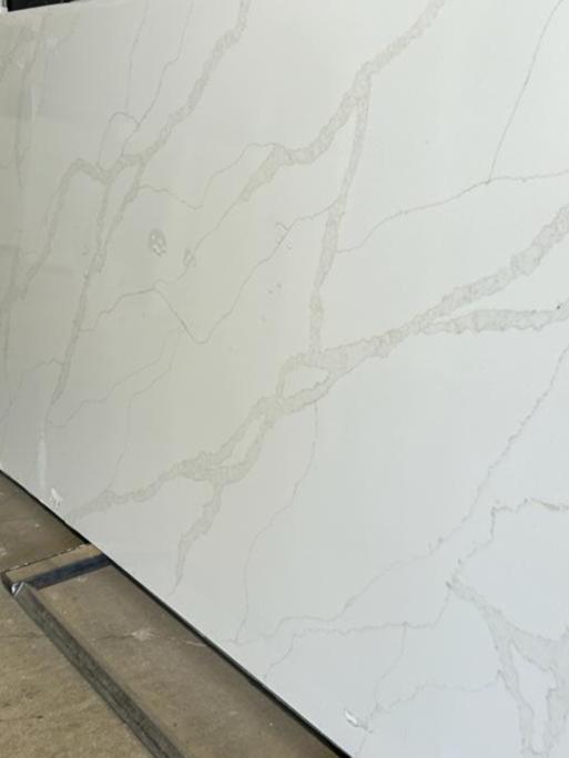 White quartz with soft gray countertops full slab.