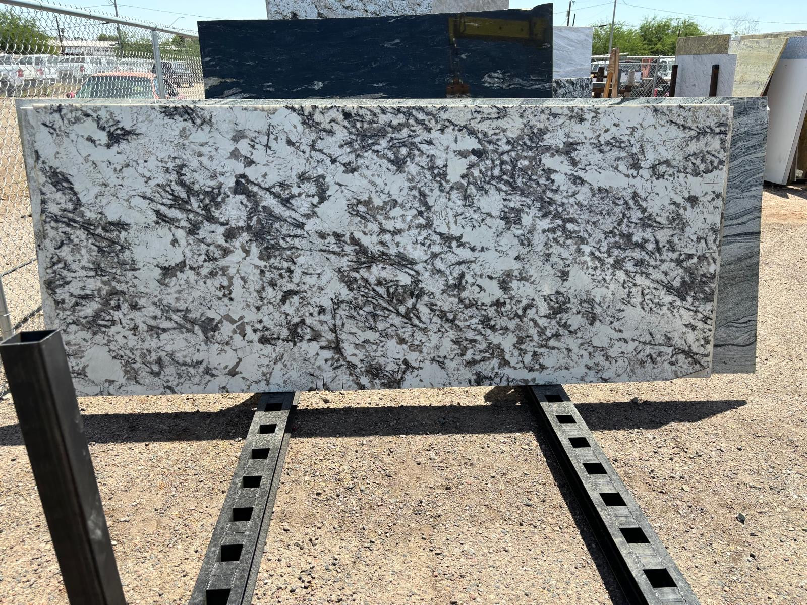 Stunning granite piece with cream, brown, black and gray veins.