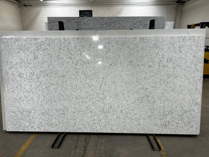 White quartz full slab with black and gray texture to make it look like marble.