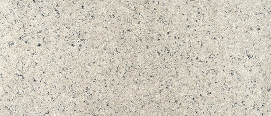 Full beige countertop slab with brown and black freckles. 