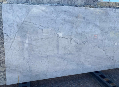 White marble with gray veining remnant.