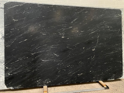 Matte Black Granite full slab with some white veins. Modern contemporary design.