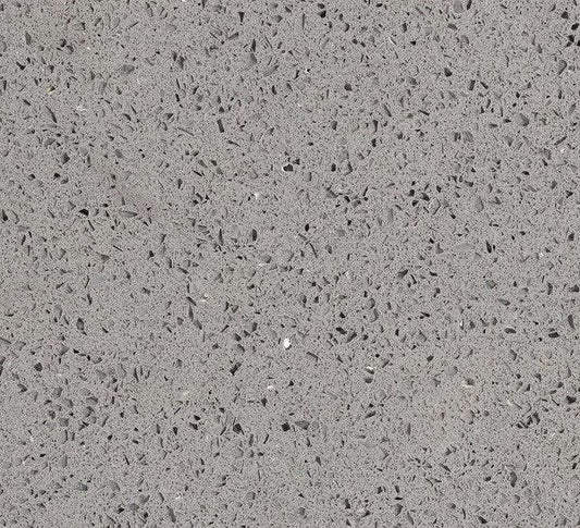 Grey full slab quartz countertop with black freckles.