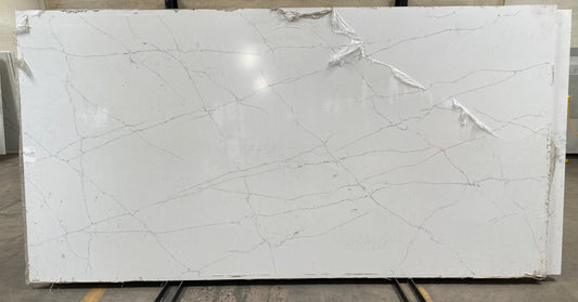 Single white quartz slab with gray veining. Perfect for countertop remodel