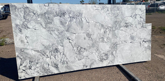 Glossy white marble with gray design. Modern and timeless stone for any upgrade.