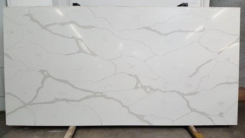 Classic Calacatta white quartz countertop for modern kitchens. Upgrade your space today with this slab at a good price.