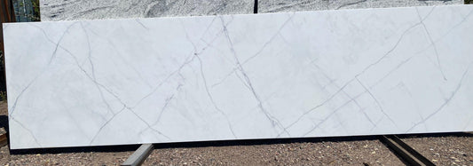 Grey veins on white quartz. Modern timeless look without all the maintenance of a natural stone. For sale to the public. 2CM remnant.