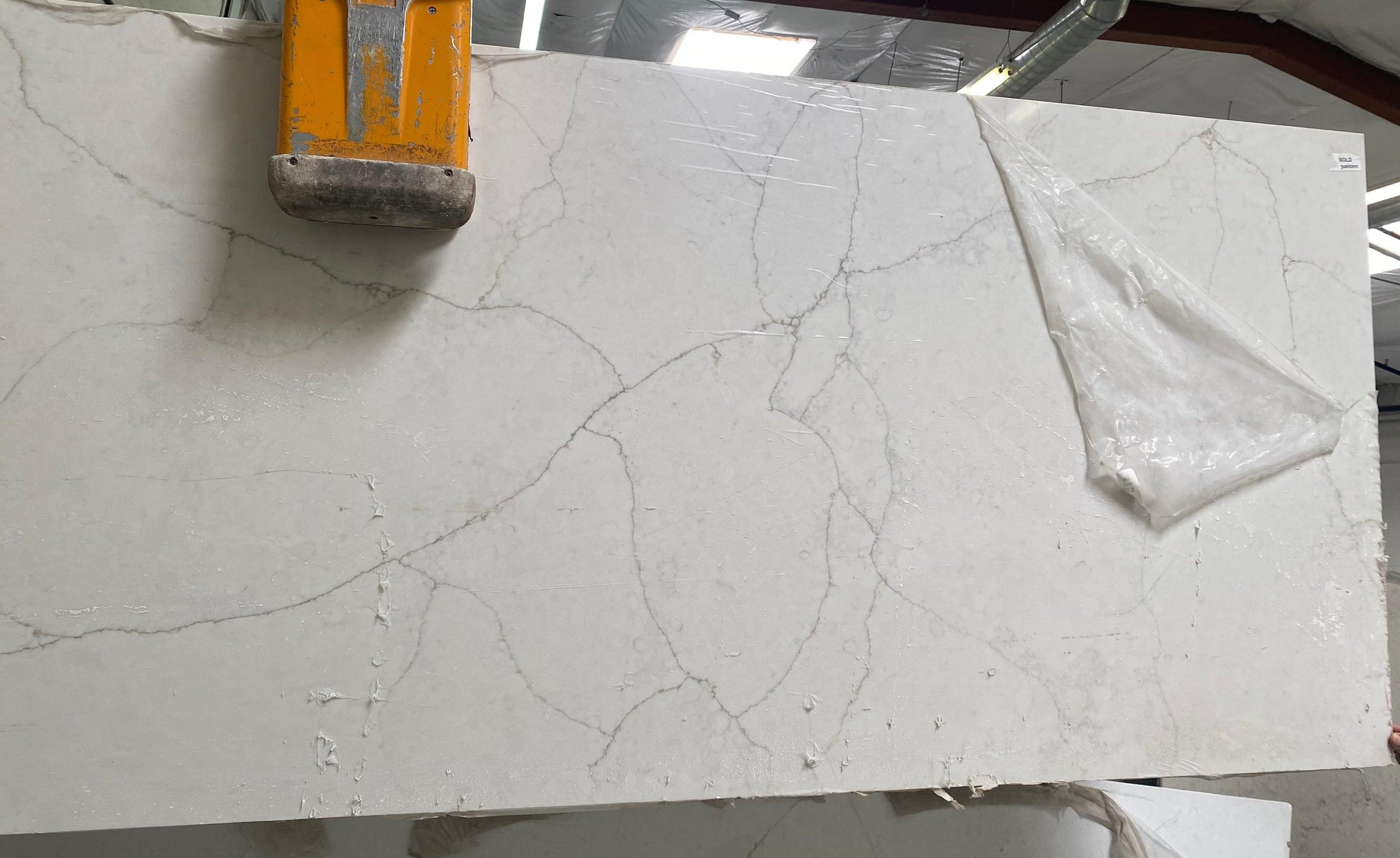 Glossy off-white with gray veins quartz remnant perfect for your bathroom, laundry room or any small project.