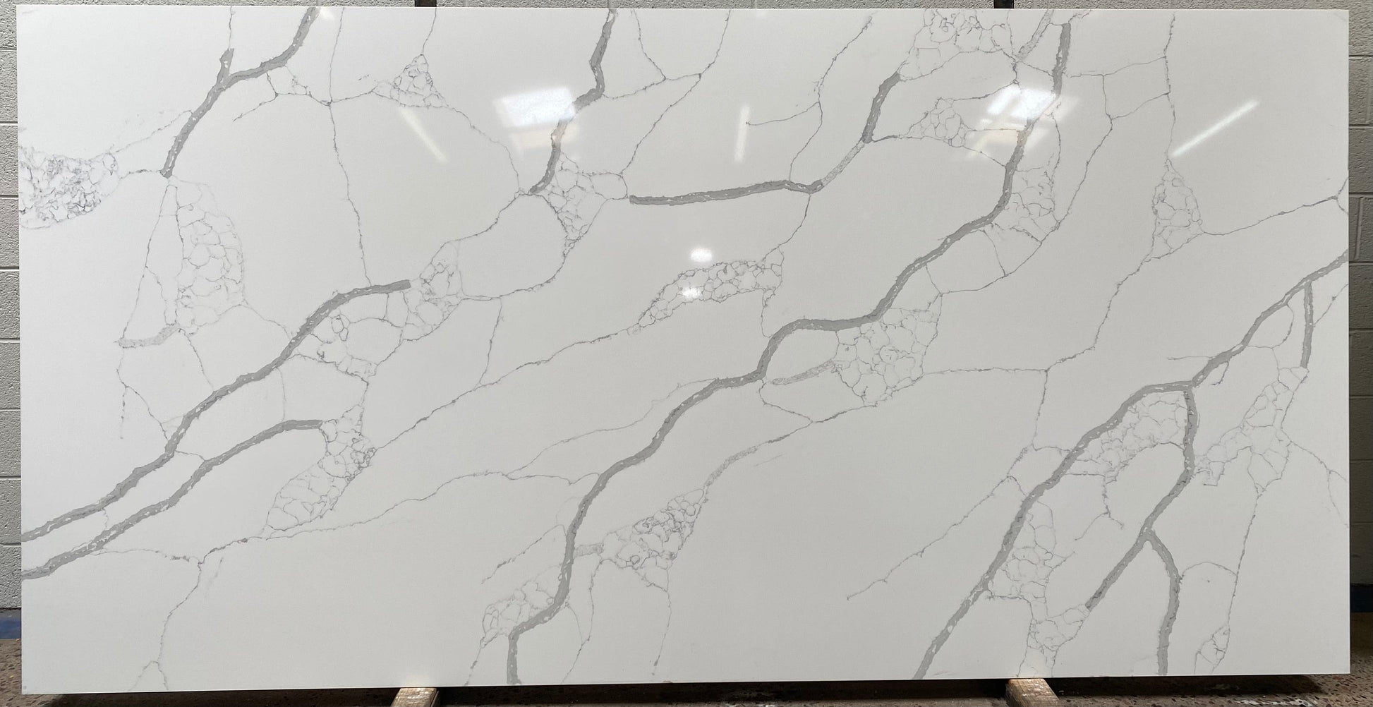 Gray veined quartz on a polished white background full quartz slab with an Italian look.