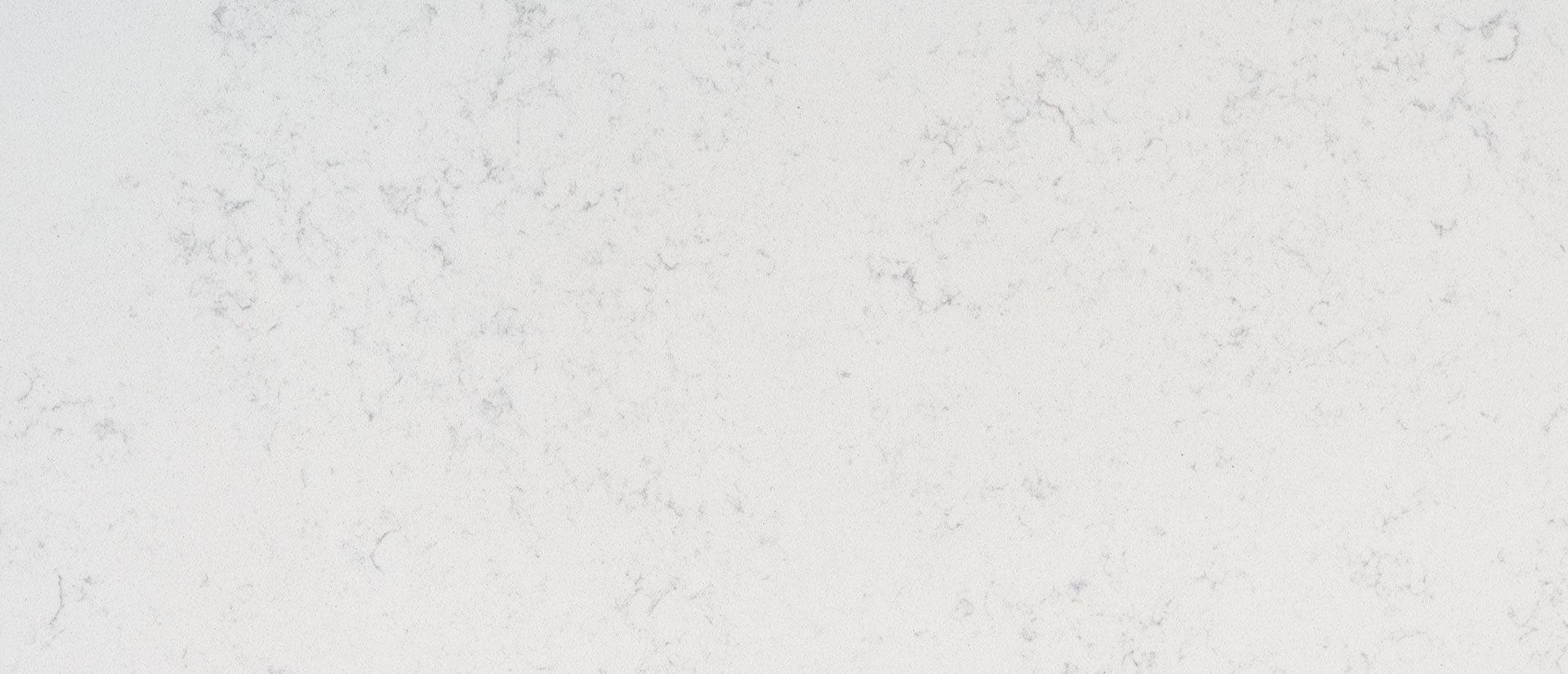 Smooth elegant design for a white quartz countertop slab available in 2cm and 3cm