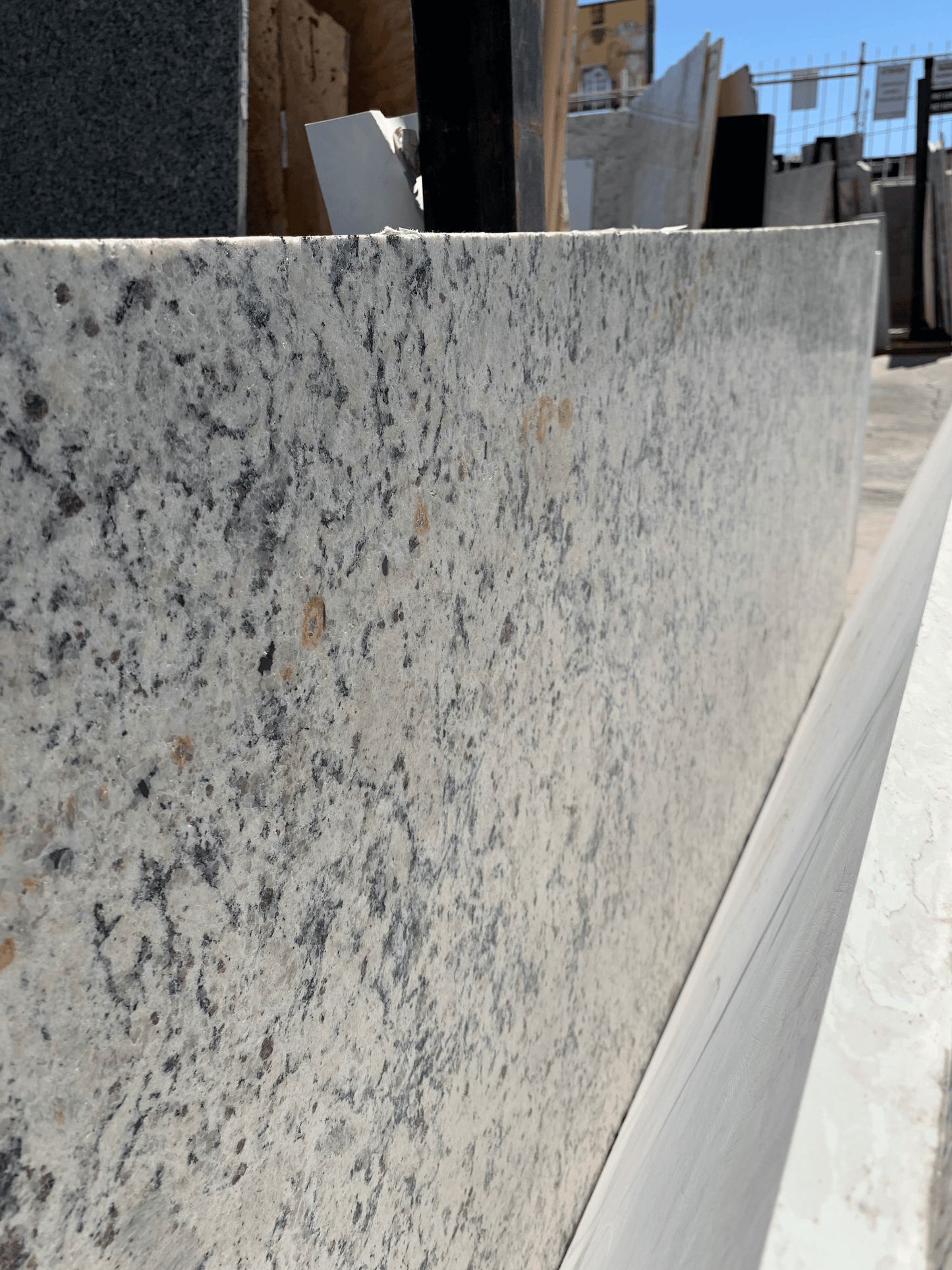 Cream and gray granite remnant.